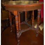 An Edwardian walnut octagonal two-tier occasional table