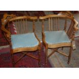 A pair of Edwardian beech and floral inlaid corner chairs