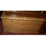 A modern pine round cornered hinge-top blanket box