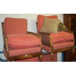 An Art Deco walnut and rosewood inlaid three piece canework bergère suite, having two-seater sofa,