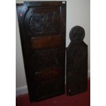 An antique low relief carved oak three panelled wall panel;