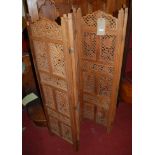 An Indian low relief carved and pierced teak fourfold screen, each panel w.