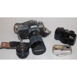 A small collection of assorted cameras and equipment to include Minolta XE camera with Tamron lens