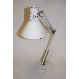 A white painted anglepoise style desk lamp