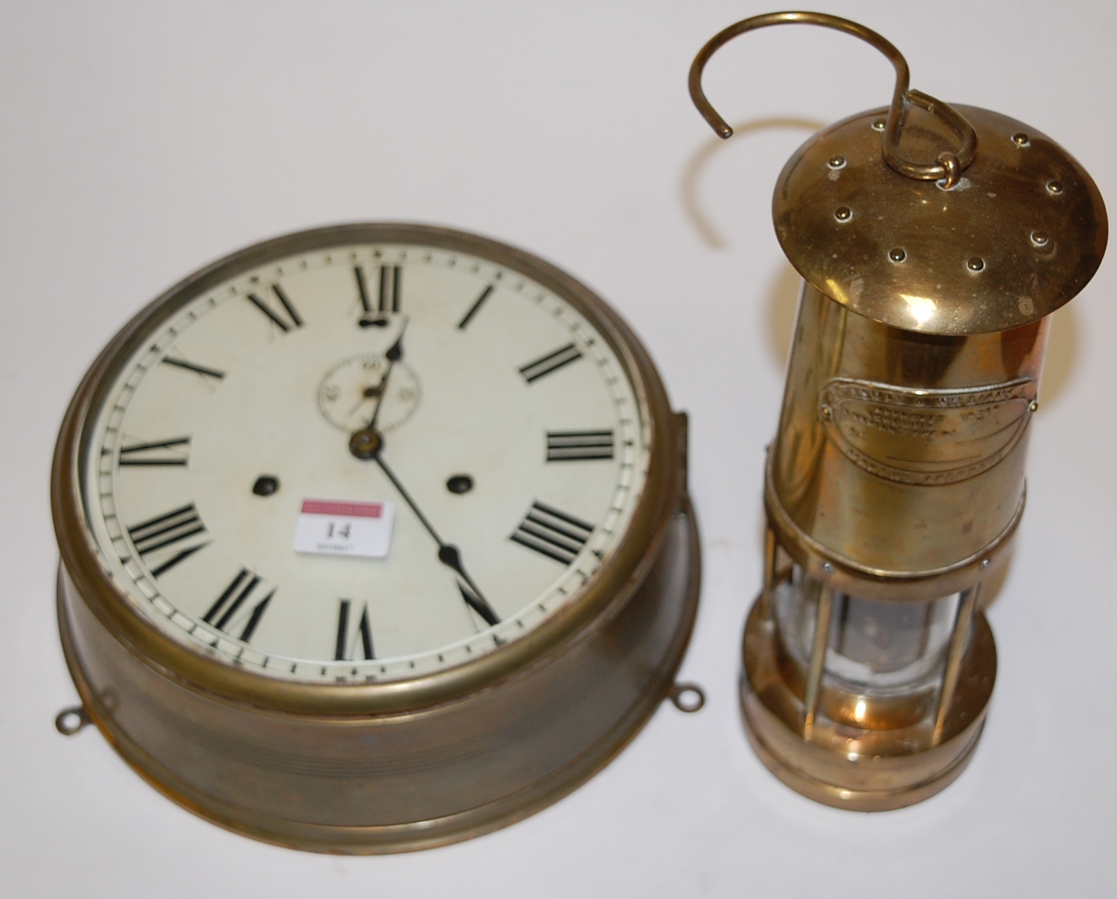 A mid-20th century brass cased ships clock,