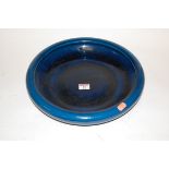 A mid 20th century Wedgwood shallow bowl on a deep blue ground,