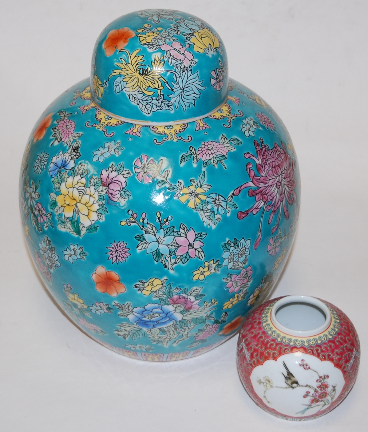 A large reproduction Chinese style ginger jar and cover, on a blue ground with floral decoration, h.