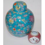 A large reproduction Chinese style ginger jar and cover, on a blue ground with floral decoration, h.