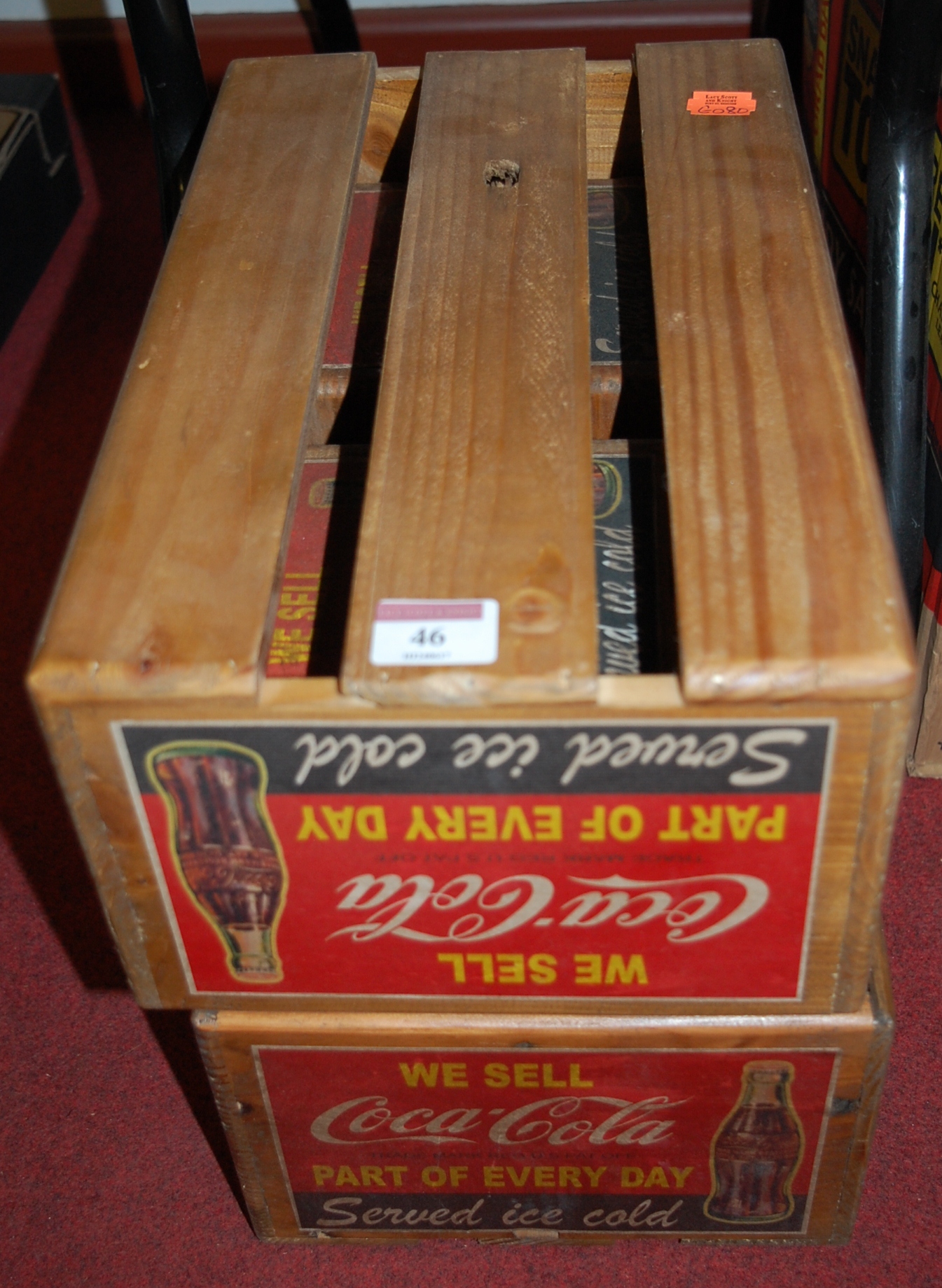 A set of four slatted wooden crates,