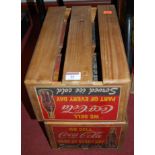 A set of four slatted wooden crates,