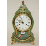A reproduction French style green painted and gilt decorated mantel clock,