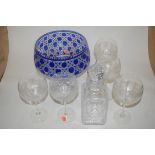 A large heavy blue overlaid and cut glass pedestal bowl together with a cut glass decanter and