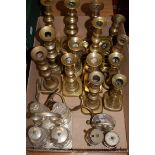 A collection of 19th century and later turned brass candlesticks together with an early 20th