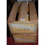 A set of four slatted wooden crates,