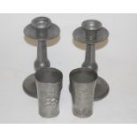 A pair of Arts & Crafts hammered pewter table candlesticks, h.