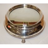 A 20th century silver plated and mirrored wedding cake stand having floral engraved decoration