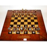 A reproduction mahogany and cut brass inlaid games board,