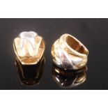 A pair of modern 18ct yellow & white gold earrings each hinged and with raised decoration, 17.4g, 2.