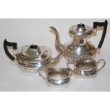 A Viners of Sheffield silver plated four piece tea and coffee service of half gadrooned form