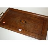 An Edwardian oak and rosewood crossbanded twin handled serving tray,