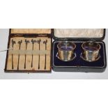 A cased set of six early 20th century silver cocktail sticks each surmounted by a rooster,