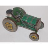 Mettoy Tractor, green tinplate and clockwork Tractor with steerable front wheels, includes seats,
