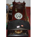 An early 20th century black slate mantel clock of architectural form,