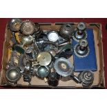 A box of miscellaneous metalwares to include silver plated table candlesticks, goblets,
