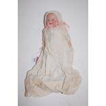 A small early 20th century Armand Marseille bisque headed doll, having rolling eyes, open mouth,