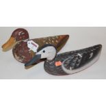 A pair of mid-20th century painted wooden decoy ducks (break to beak and neck)