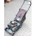 A Briggs & Stratton Hayter Quantum XM45 petrol driven lawn mower with grass collecting box