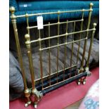 A Victorian turned brass single bed having iron side rails