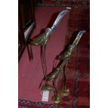 Three contemporary graduated metal heron sculptures,