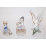 A large Lladro figure of a dove perched on a branch, printed mark verso, height 30cm,