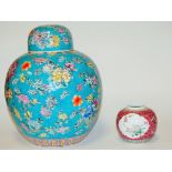 A large reproduction Chinese style ginger jar and cover, on a blue ground with floral decoration, h.