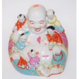 A reproduction stoneware and enamelled 'Happy Buddha' figure,