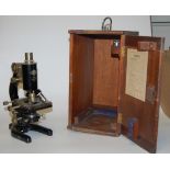 An early 20th century brass and iron monocular microscope by Pry of London No.