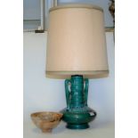 A 1970s green glazed twin handled pottery lamp base with shade,