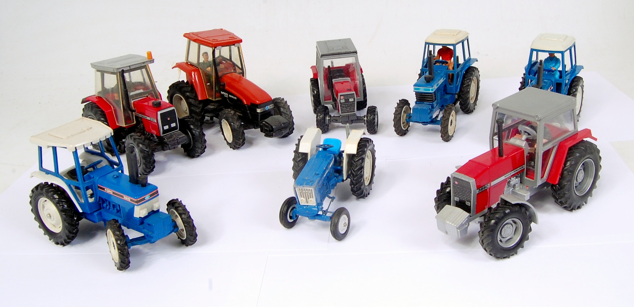 8 assorted loose Britains Tractors, mixed examples to include Ford 5610, Ford 7710,