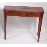 A George III mahogany tea table, the D-shaped fold-over top above a chequer strung frieze,