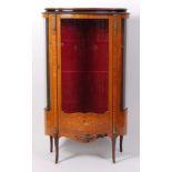 A circa 1900 French kingwood vitrine, having velvet lined interior with plate glass shelves,