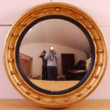 A Victorian giltwood and gesso convex wall mirror,