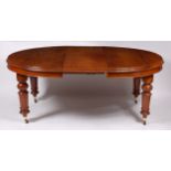 A late Victorian mahogany extending dining table, the top having oval ends and with a moulded edge,