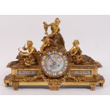 A mid-19th century French gilt bronze and porcelain inset mantel clock,