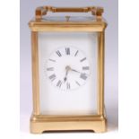 A circa 1900 French lacquered brass carriage clock, having visible platform escapement,