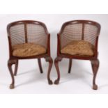 A pair of circa 1900 mahogany Bergère chairs,