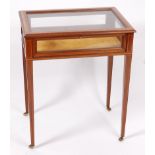 An Edwardian mahogany, satinwood crossbanded, and boxwood strung bijouterie table,