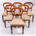 A set of six Victorian mahogany balloon back dining chairs,