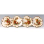 A set of four Royal Worcester Hadley ware dessert plates, each of triform,