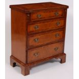 A walnut and figured walnut bachelors chest, in the early 18th century style,